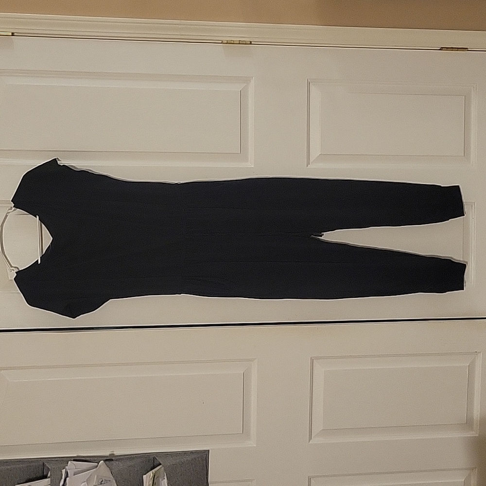 Women's Black one piece Jumper with pockets.  Size Large.